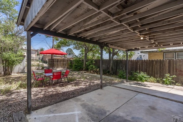 219 E 2nd St, Pueblo, CO 81003 - view of patio featuring outdoor dining area and a fenced backyard