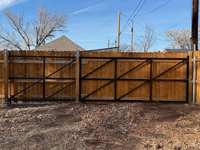 view of gate with fence