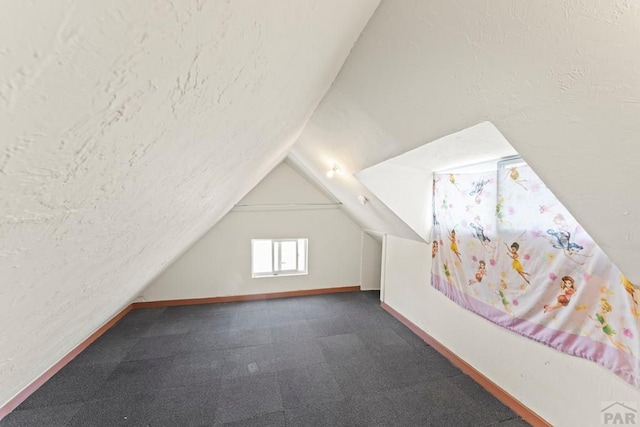 616 E 5th St, Pueblo, CO 81001 - bonus room featuring baseboards and lofted ceiling
