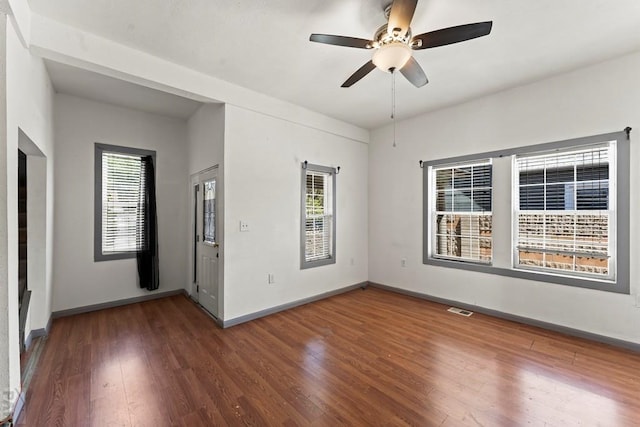 616 E 5th St, Pueblo, CO 81001 - spare room with visible vents, wood finished floors, and a wealth of natural light