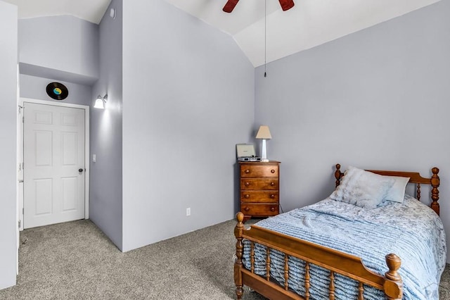carpeted bedroom with lofted ceiling and a ceiling fan