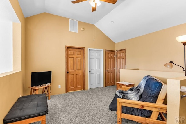 living area featuring ceiling fan, lofted ceiling, visible vents, and carpet