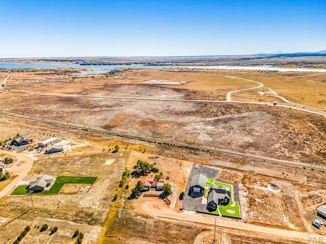 bird's eye view with a rural view and a water view