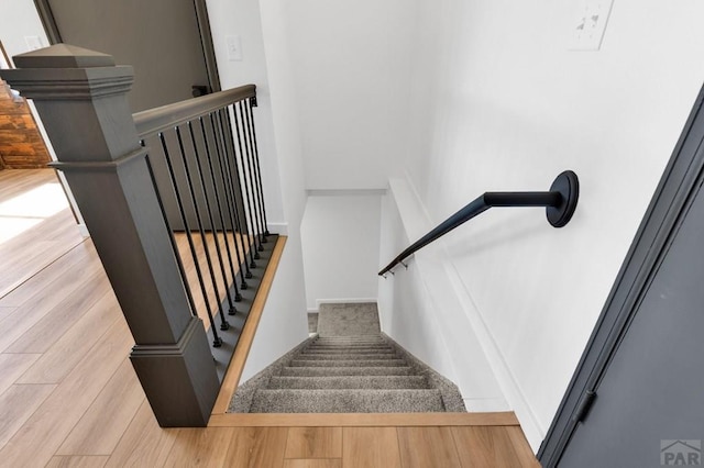 stairs with wood finished floors