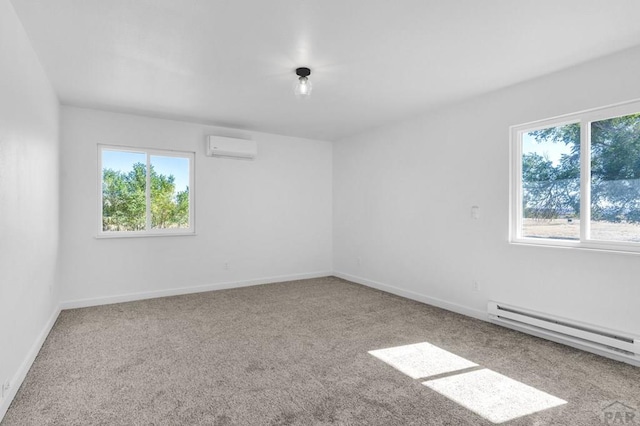 empty room featuring a wall unit AC, baseboards, carpet floors, and baseboard heating