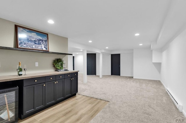 bar featuring wine cooler, recessed lighting, a baseboard heating unit, light carpet, and a dry bar