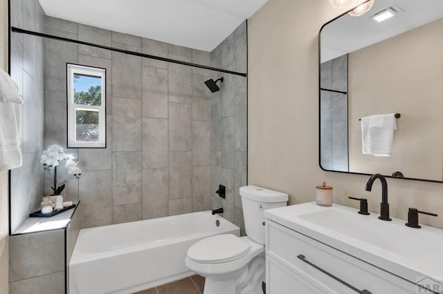 bathroom featuring vanity, toilet, and shower / bathtub combination