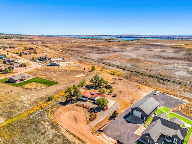 birds eye view of property featuring a rural view