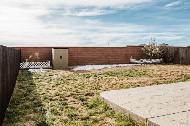 view of yard with a fenced backyard