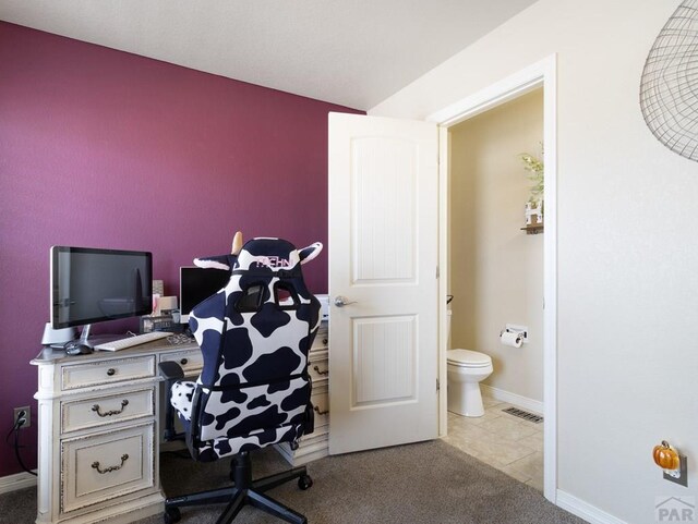 office space with light carpet, baseboards, and visible vents