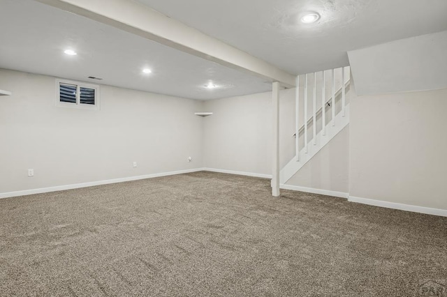 finished below grade area with carpet, stairs, baseboards, and recessed lighting