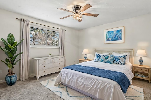 carpeted bedroom featuring ceiling fan and baseboards