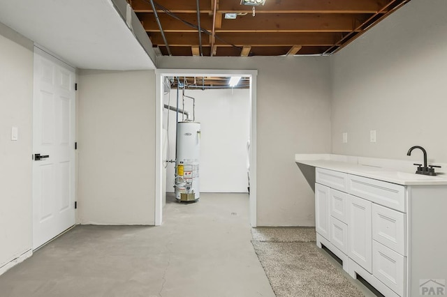 unfinished basement with a sink and gas water heater