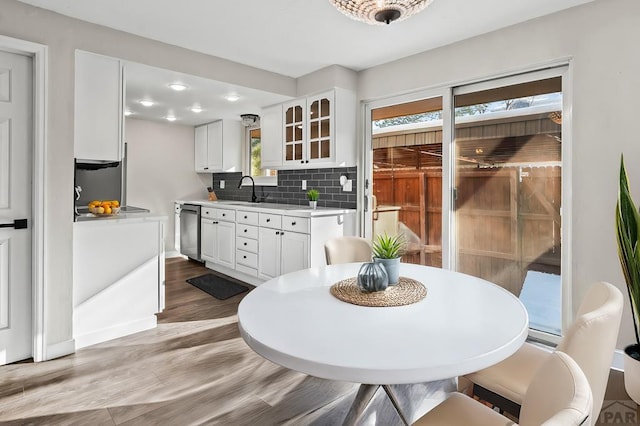 dining room featuring light wood-type flooring and baseboards