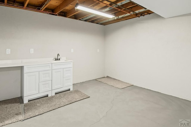 finished basement featuring a sink