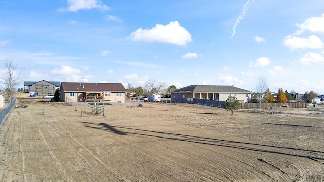 view of yard featuring a residential view and fence