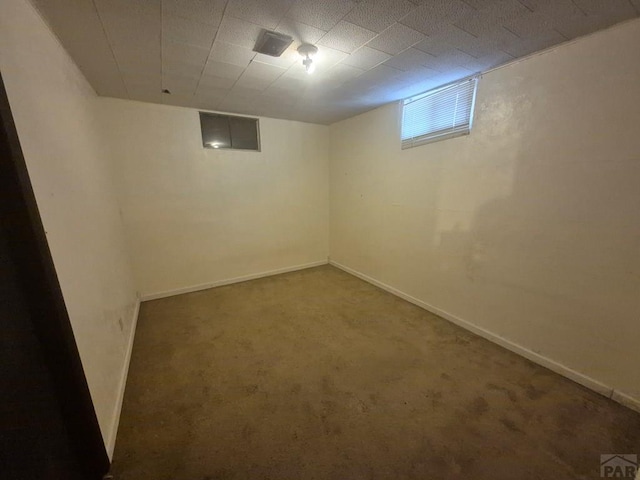 basement featuring carpet and baseboards