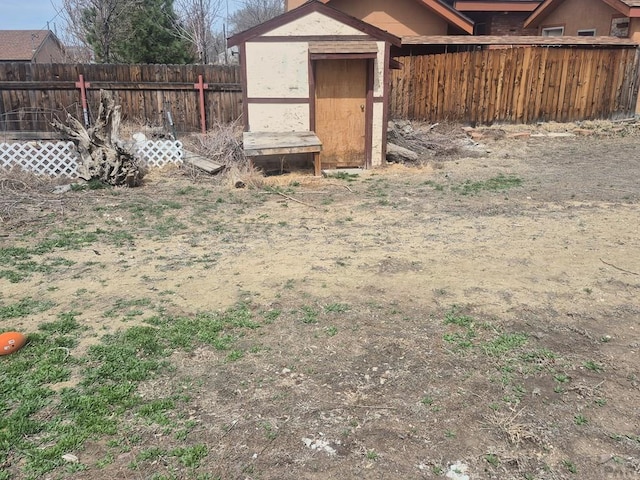 view of shed featuring a fenced backyard