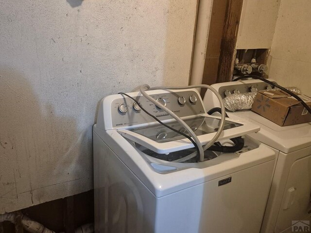 laundry area with independent washer and dryer and laundry area
