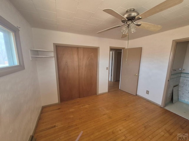 unfurnished bedroom featuring light wood finished floors and ceiling fan
