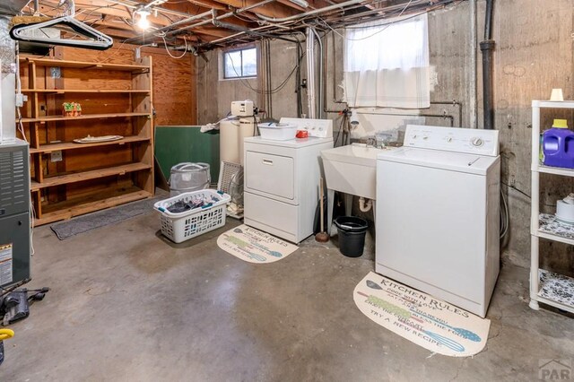 1329 Alexander Cir, Pueblo, CO 81001 - below grade area featuring independent washer and dryer