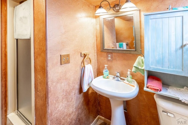 1329 Alexander Cir, Pueblo, CO 81001 - full bathroom with a shower with shower door and a textured wall