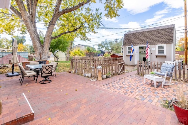 1329 Alexander Cir, Pueblo, CO 81001 - view of patio featuring a storage unit and outdoor dining space