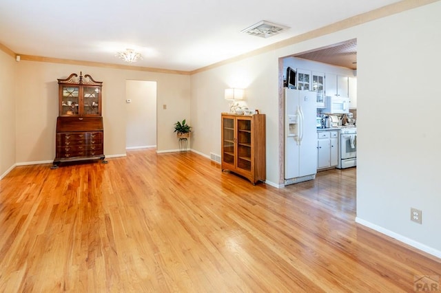 1329 Alexander Cir, Pueblo, CO 81001 - empty room with light wood finished floors