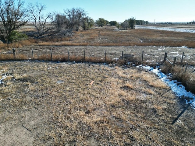 view of yard featuring a water view and a rural view