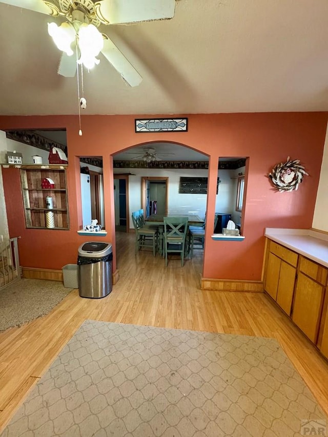 17345 US Highway 50, Las Animas, CO 81054 - dining space with arched walkways, light wood-style floors, and a ceiling fan