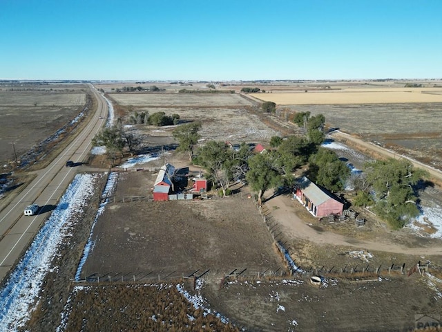 birds eye view of property with a rural view