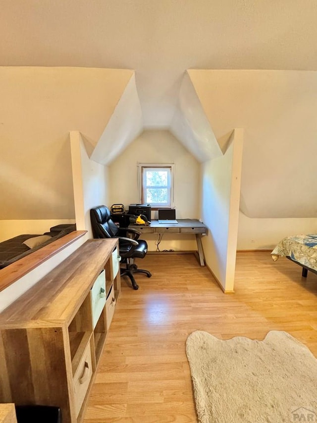 office area featuring light wood-type flooring and lofted ceiling