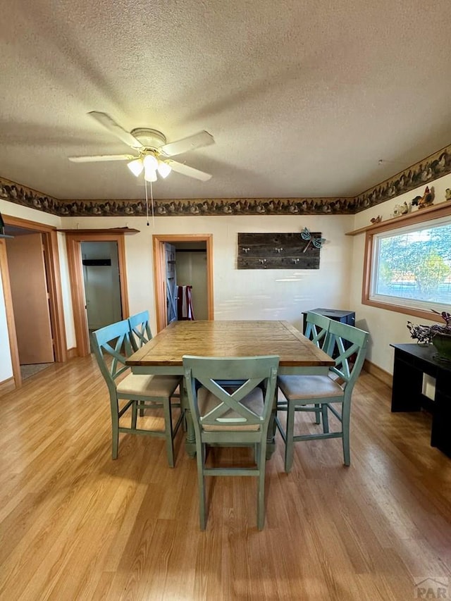 17345 US Highway 50, Las Animas, CO 81054 - dining room featuring a textured ceiling, light wood finished floors, and ceiling fan