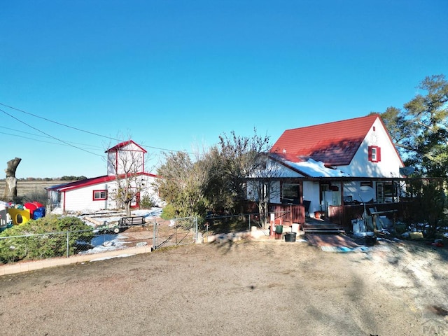 view of front of home with fence