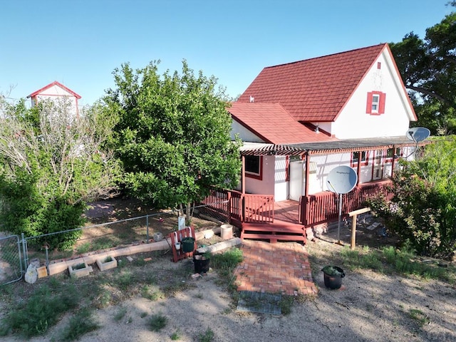 17345 US Highway 50, Las Animas, CO 81054 - back of property with a wooden deck, a shingled roof, a pergola, and stucco siding