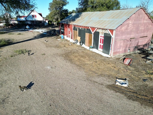 exterior space featuring an outbuilding