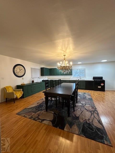 dining room featuring a notable chandelier and wood finished floors