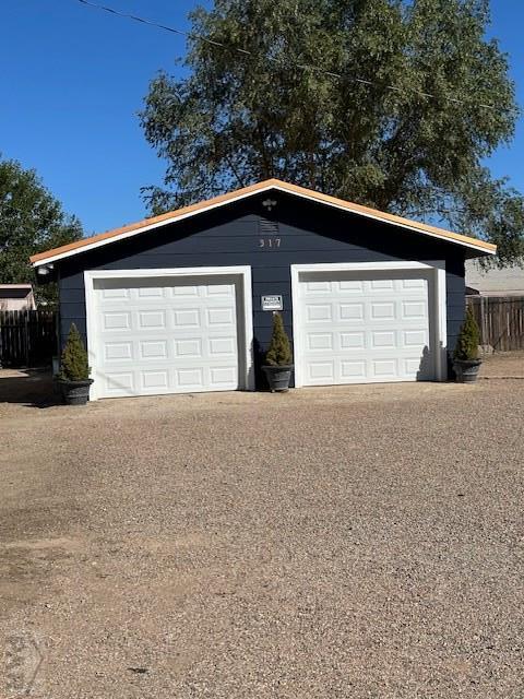 garage with fence