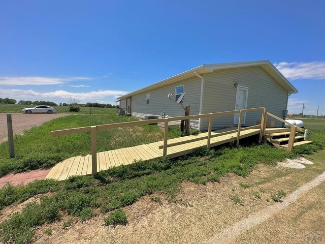 15406 County Rd E.25, Ordway, CO 81063 - view of side of property featuring a wooden deck