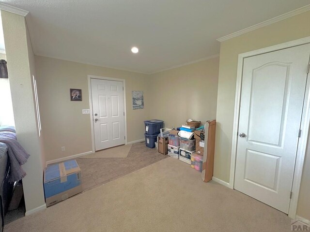 15406 County Rd E.25, Ordway, CO 81063 - interior space featuring light carpet, crown molding, and recessed lighting