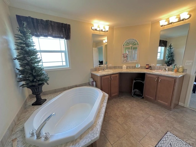 15406 County Rd E.25, Ordway, CO 81063 - bathroom with healthy amount of natural light, a garden tub, double vanity, and ornamental molding