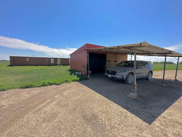 15406 County Rd E.25, Ordway, CO 81063 - view of parking / parking lot with driveway and a pole building