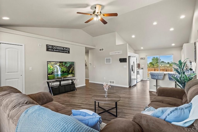 living area featuring lofted ceiling, visible vents, dark wood-type flooring, and recessed lighting