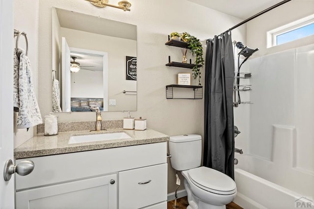 bathroom with toilet, shower / tub combo, and vanity