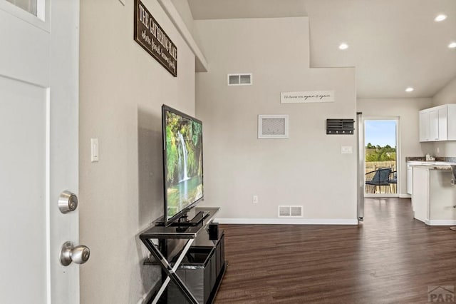 entrance foyer with dark wood-type flooring, recessed lighting, visible vents, and baseboards