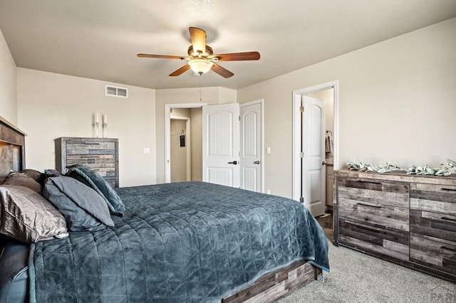 bedroom featuring carpet floors, visible vents, and a ceiling fan