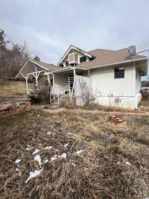 view of front of home with roof with shingles