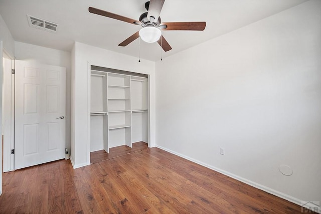 130 Montcalm Dr, Pueblo, CO 81005 - unfurnished bedroom featuring a closet, wood finished floors, and a ceiling fan
