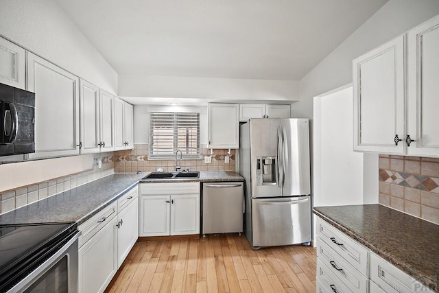 130 Montcalm Dr, Pueblo, CO 81005 - kitchen featuring appliances with stainless steel finishes, white cabinets, and light wood-type flooring