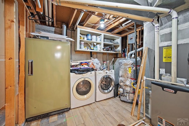 130 Montcalm Dr, Pueblo, CO 81005 - laundry room featuring washer and clothes dryer and wood finished floors